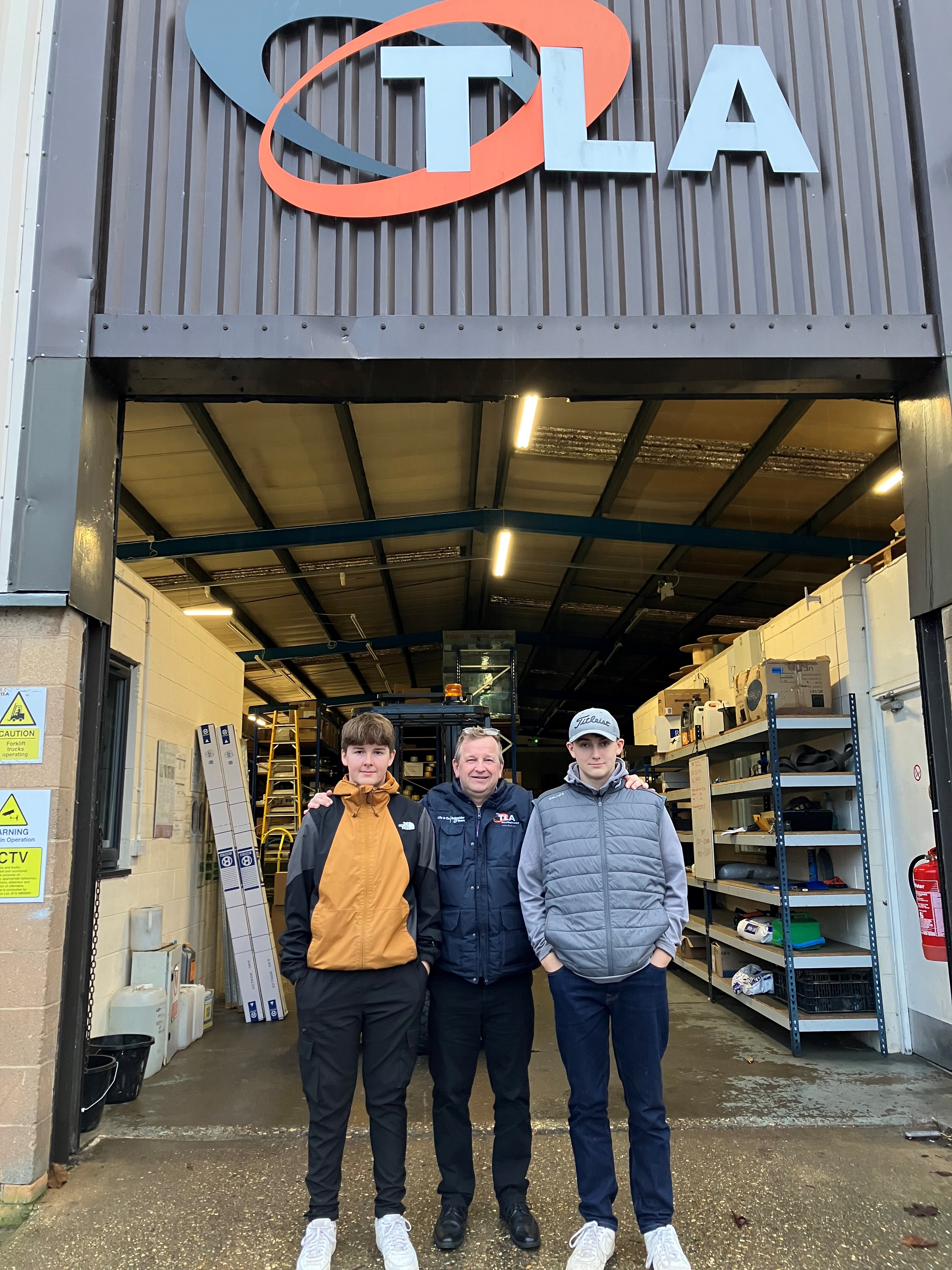 Nick Statham and his sons outside TLA Northampton branch